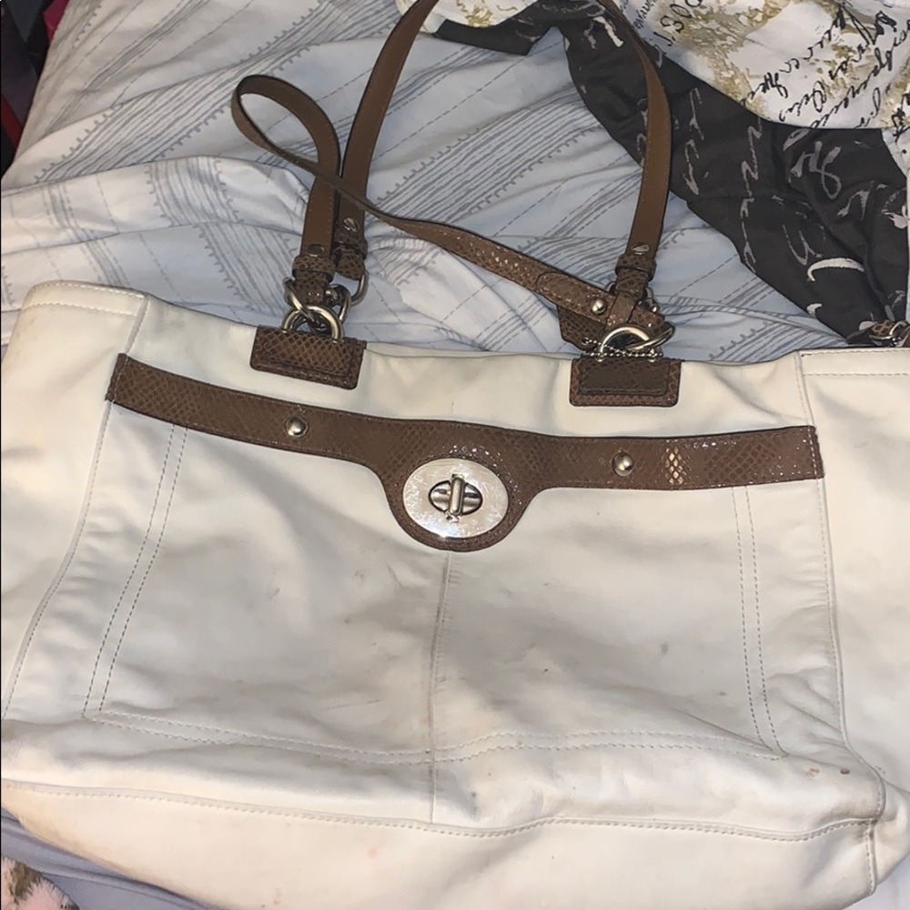Used White Coach hand purse.